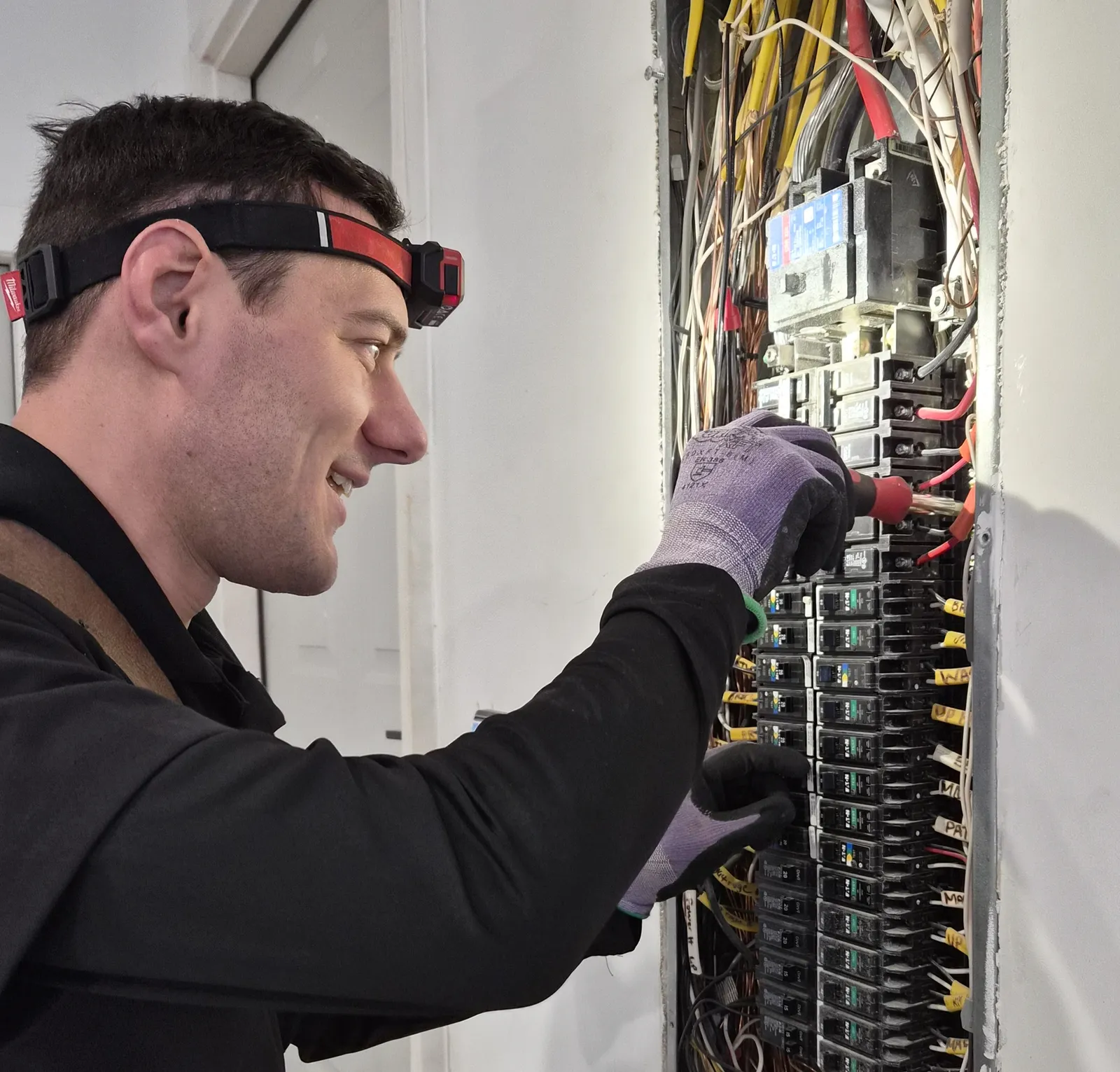 Electrician working on panel